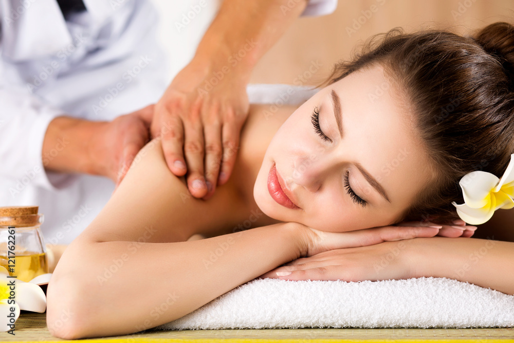 Beautiful young woman laying at spa salon Beautiful young woman laying at spa salon