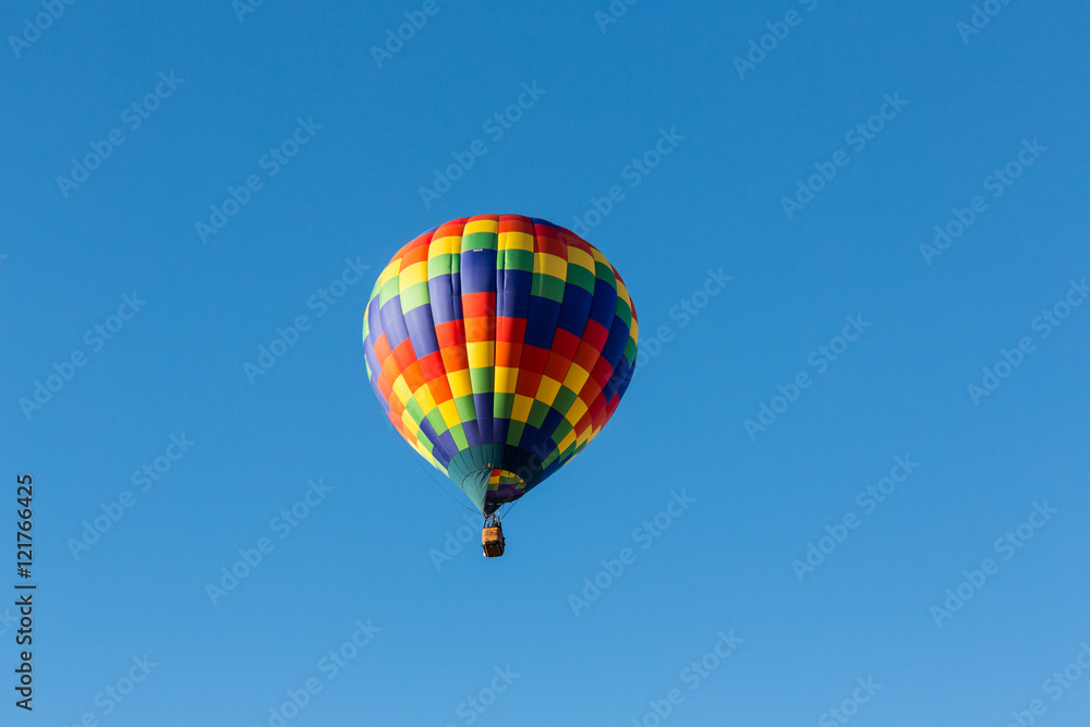 Hot air balloons in the air at a festival Hot air balloons in the air at a festival