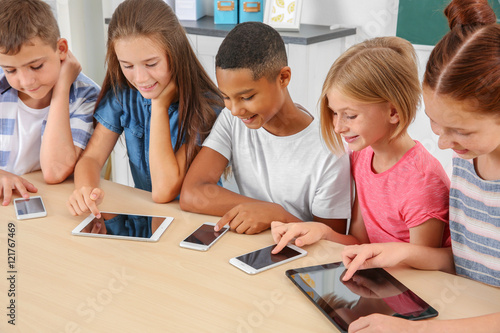 Schoolchildren sitting in c...