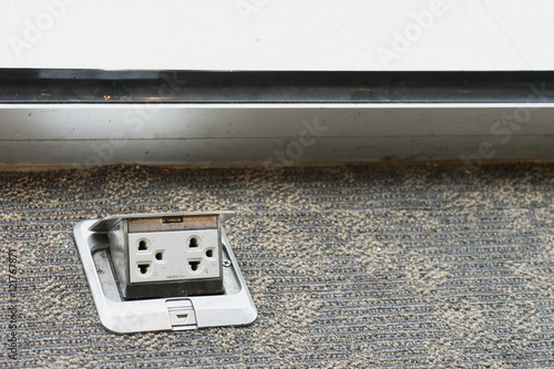 electric plug adapter on floor ready to use as electric appliance at home or office