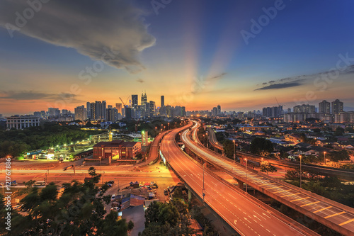 Photography Kuala Lumpur city skyline on sunset ray of light sky