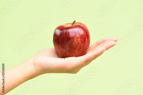 Apple fruit holding by hand