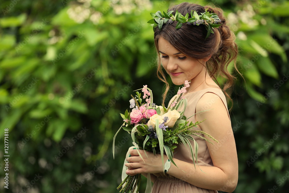 Beautiful bridesmaid holding bouquet Beautiful bridesmaid holding bouquet