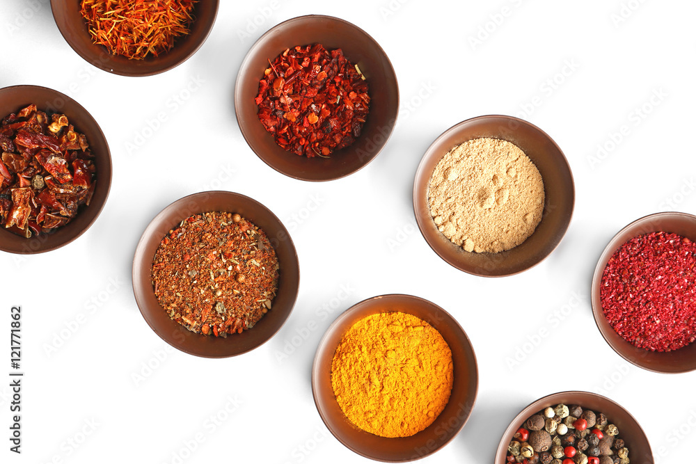 Flat lay of assorted herbs and spices on white background Flat lay of assorted herbs and spices on white background