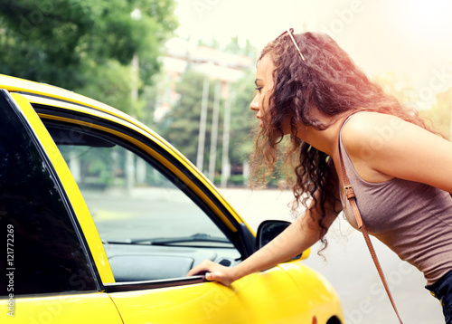 Taxi passenger near car