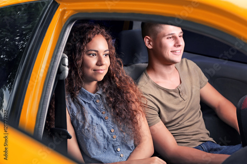 Young couple in taxi car