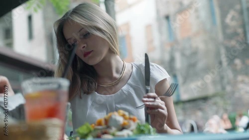 Businesswoman taking cutlery and prepars herself to eat the lunch
 photo