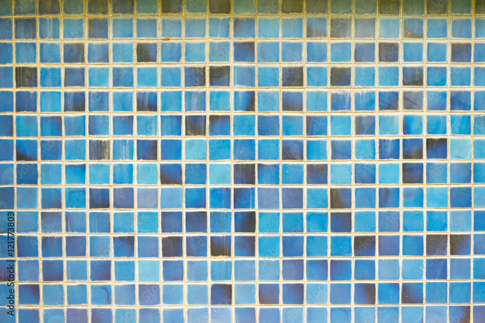 the old, dirty, alkali, rust dark blue and brown chipped wall tiles of the building background texture the old, dirty, alkali, rust dark blue and brown chipped wall tiles of the building background texture