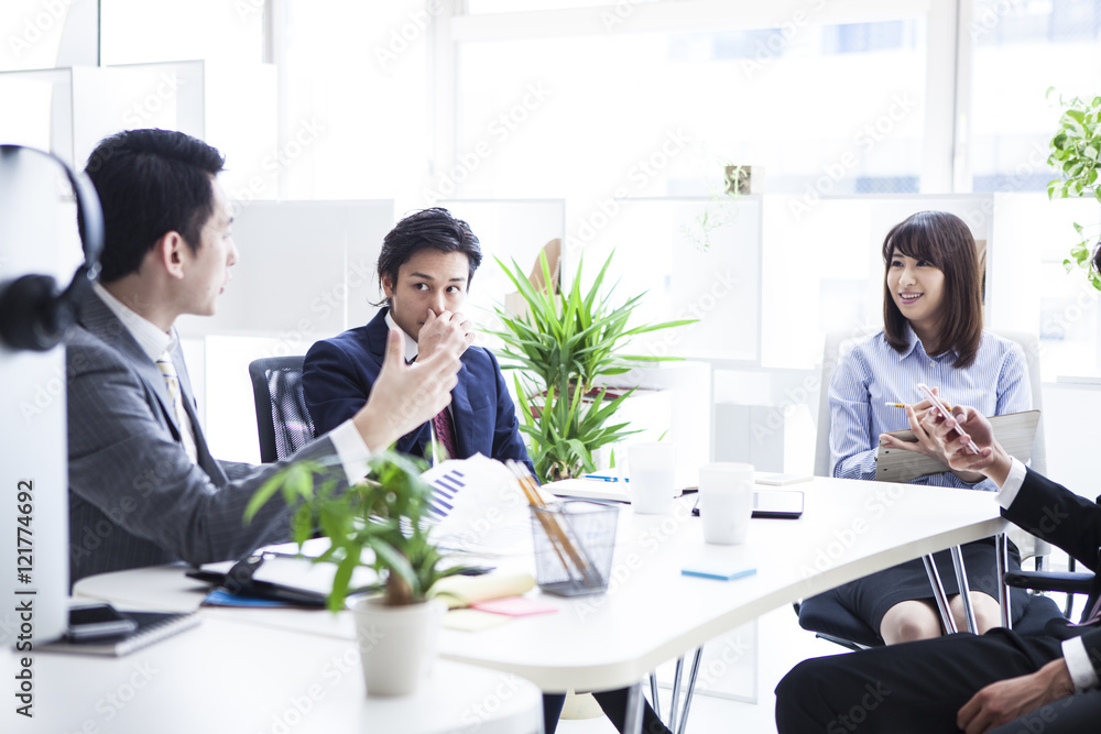 Four businessmen are meeting in the office Four businessmen are meeting in the office