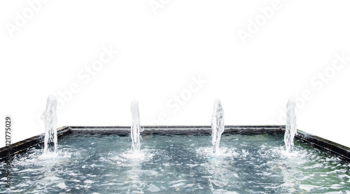 Fountain water spout spray in luxury basin on white background photo