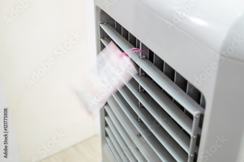 Evaporative air cooler front running blown flick photo