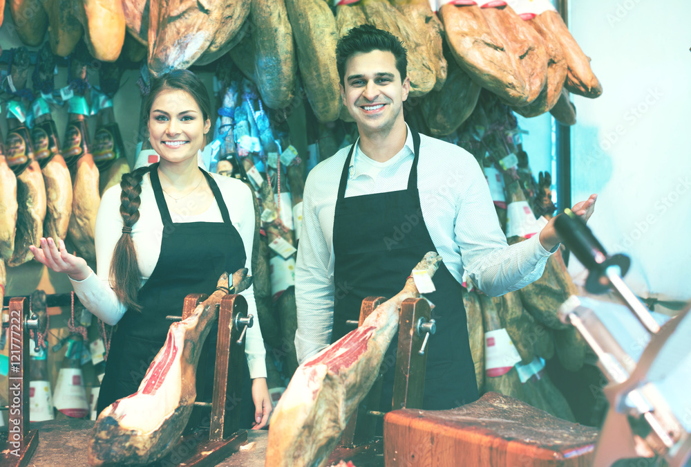 Two workers selling jamon