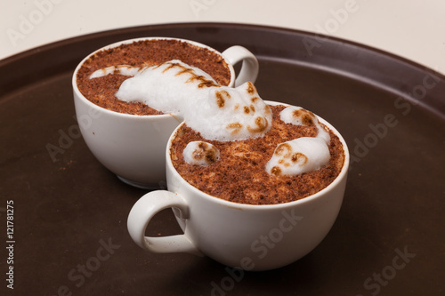 Coffee with foam in the form of cat and mouse