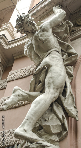 Canvas-taulu male figure sculpture on the facade of an old house in Art Nouveau style