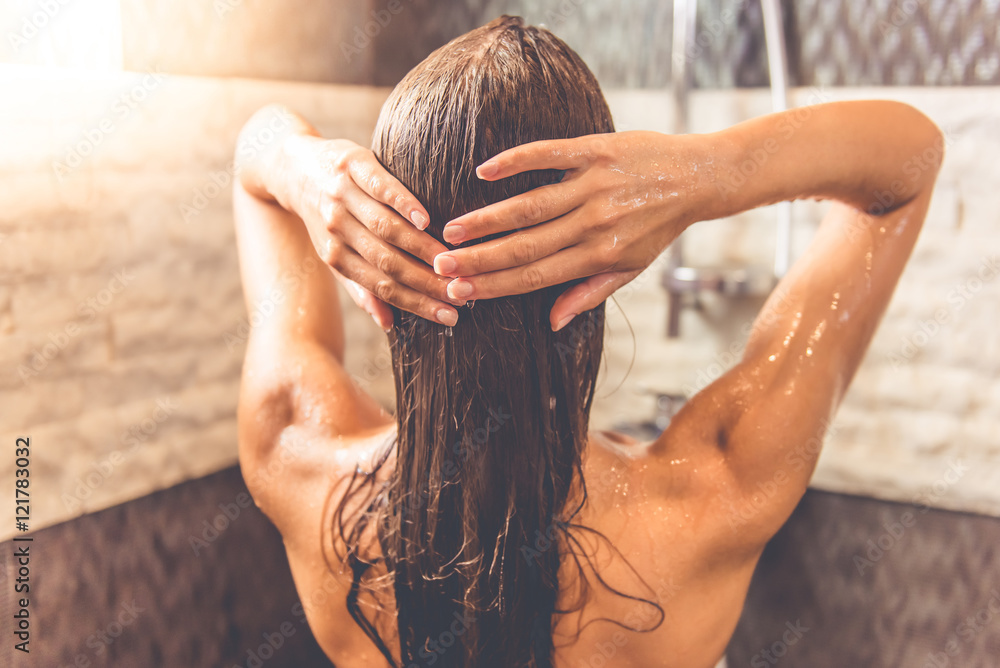 Fototapeta premium Beautiful woman taking shower