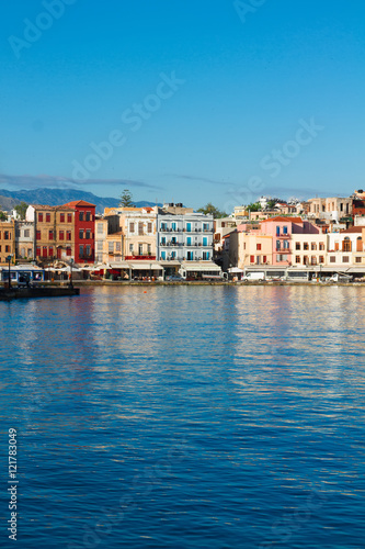 waterfront of Chania bay reflecting in water at sunny day, Crete, Greece
