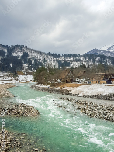 Village antique emerald river on winter season,miyama, kayabuki no sato photo