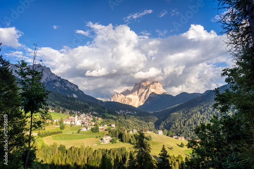 Typical summer scene in Italian Dolomites. Traditional mountain villages with majestic mountains in background. © 1tomm
