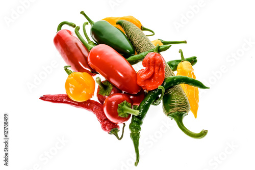 Different variety of hot peppers or chilies, isolated on white.