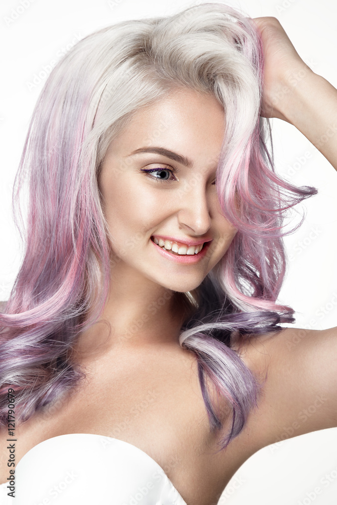 Obraz premium Young lady posing on white background. Beautiful hairstyle and hair color. Smiling face.