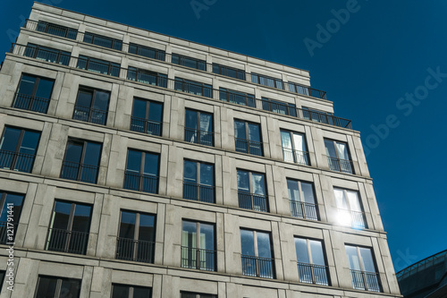 grey facade with darken blue windows