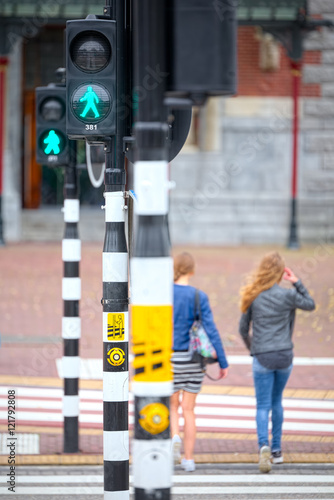 Pedestrians crossing at traffic lights