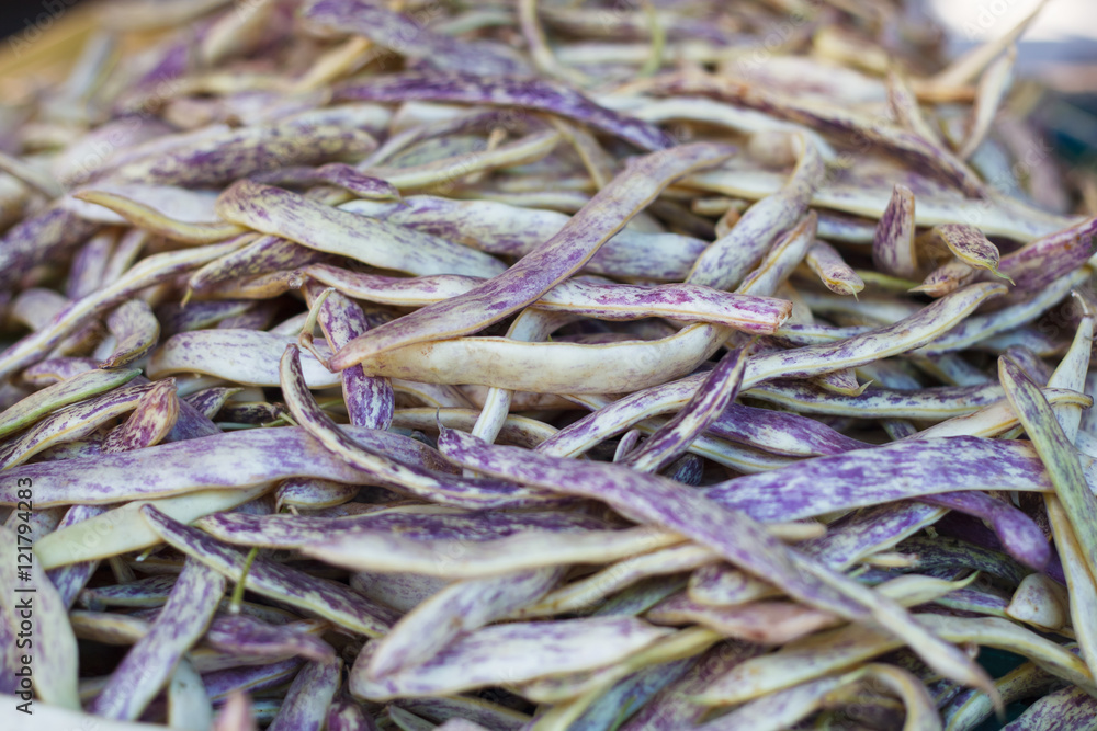 Pile of yellow red string beans at farm market. Runner beans. String beans background Pile of yellow red string beans at farm market. Runner beans. String beans background
