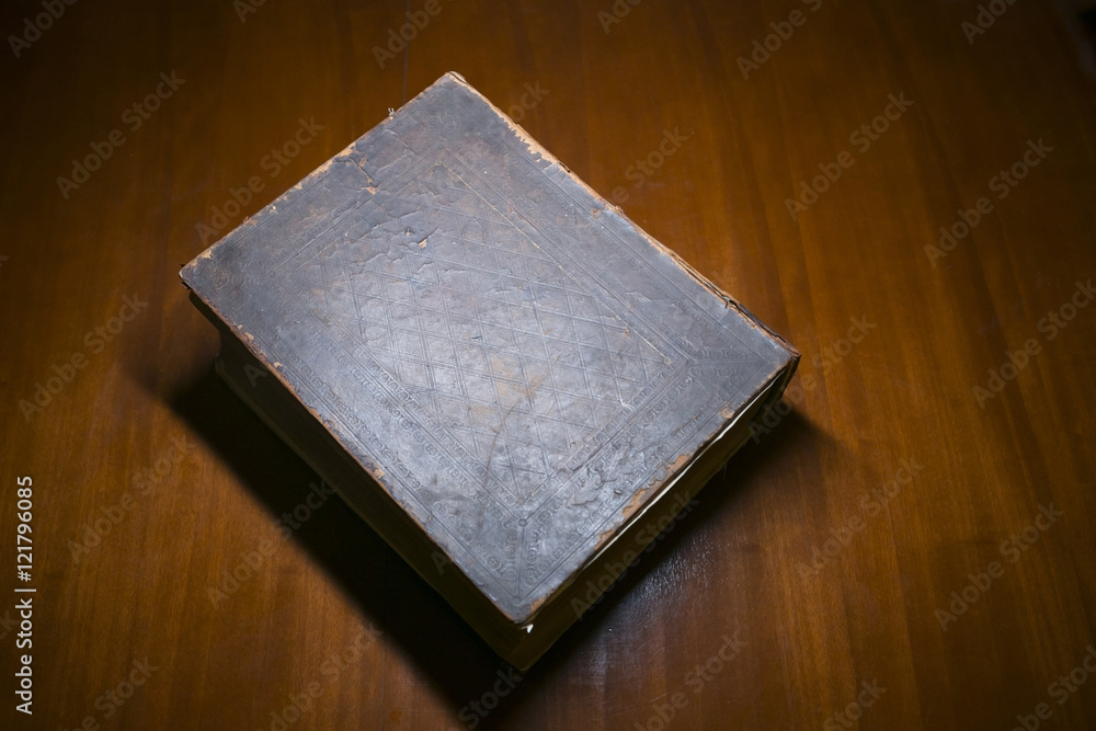 Fototapeta premium Old Book on a Desk