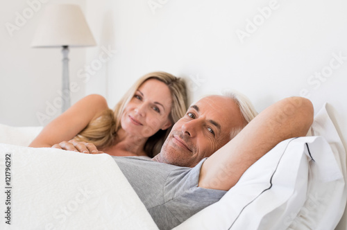 Couple lying in bed