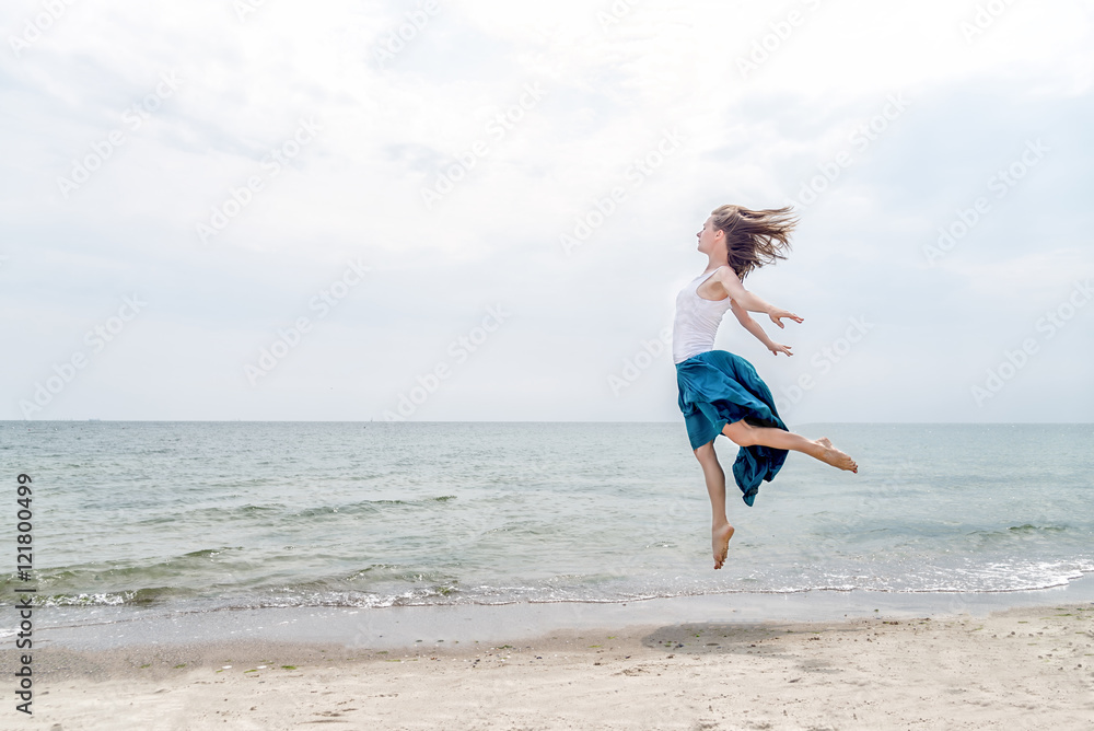 Happy beautiful young girl jumping Happy beautiful young girl jumping