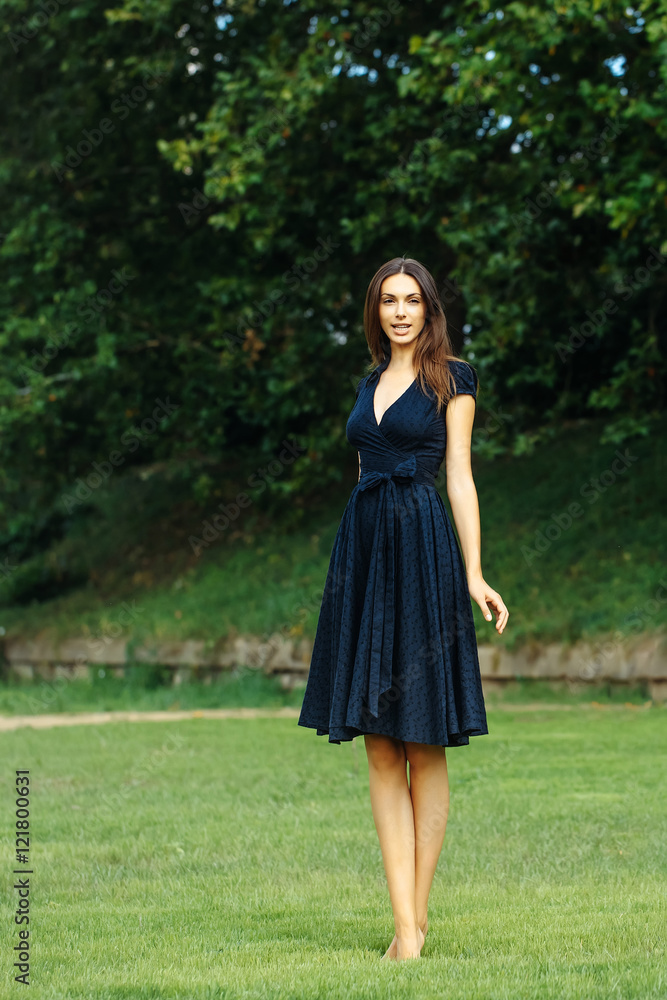 Young beautiful girl on the lawn