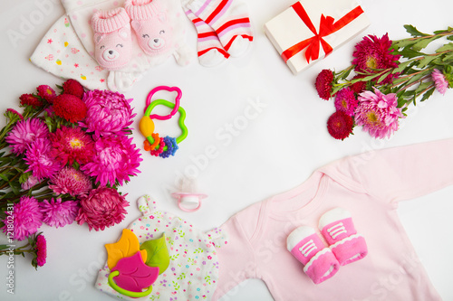 top view set of fashion trendy pink stuff for baby girl, baby fashion concept. newborn baby clothes