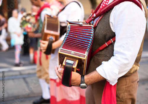 Man play accordion in carnival on street