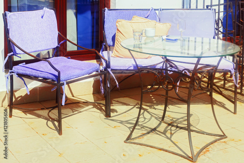 Chairs and glass table in balcony