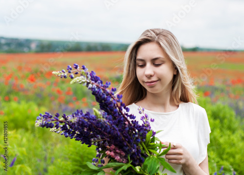 girl with bouquet of lupine flowers