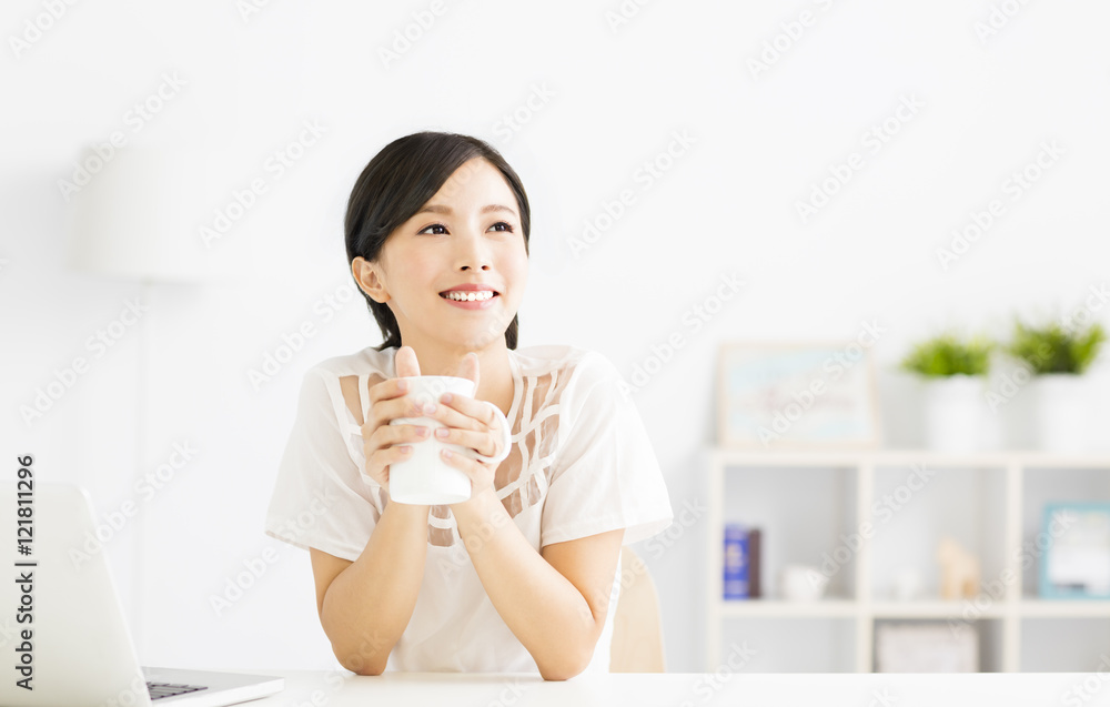 young Woman drinking coffee in living room young Woman drinking coffee in living room