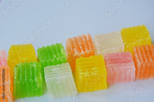 Canvastavla colorful crispy candy on white dish
