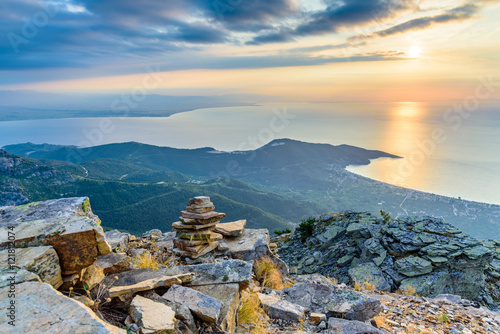 Spectacular sunrise at Thassos island, Greece, popular Greek island - tourist attraction, perfect vacation spot - view from a mountain top towards the bay of Kinira photo