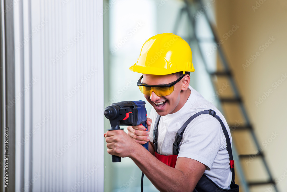 Man drilling the wall with drill perforator Man drilling the wall with drill perforator