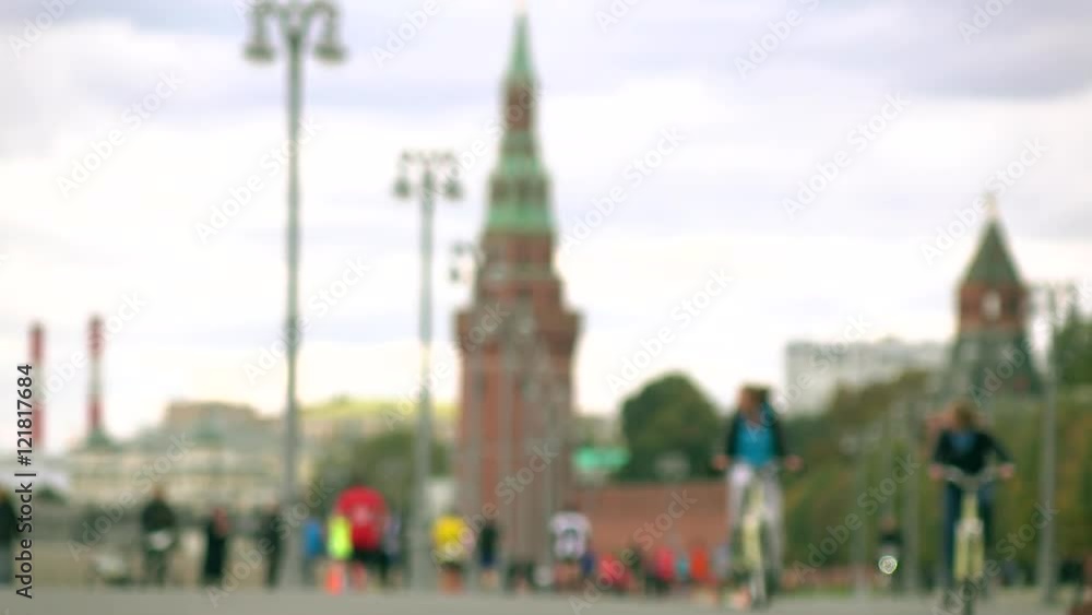 Unrecognizable blurred marathon runners and cyclists against Moscow Kremlin. 4K background bokeh long shot Unrecognizable blurred marathon runners and cyclists against Moscow Kremlin. 4K background bokeh long shot