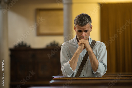 Man praying in the Church
