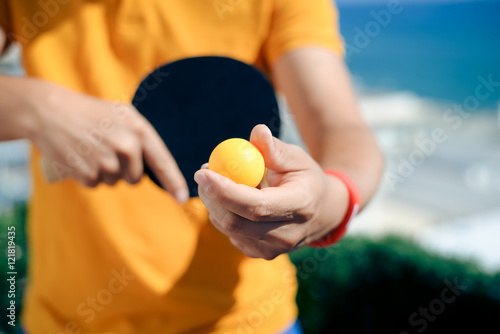 Closeup on hand holding Ping pong kit © aquar