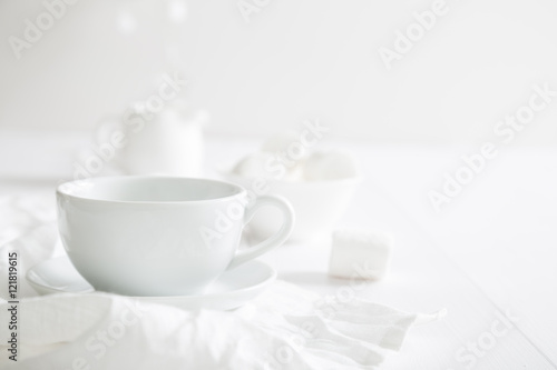 White crockery on a white table © Ruslan Mitin