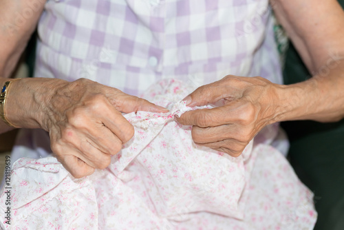 sewing elderly person