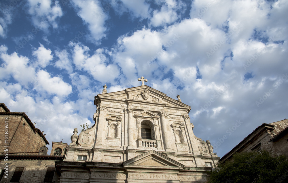Baroque facade of San Filippo Neri church with beautiful clouds at sunset, in the historic center of Perugia (17th century)