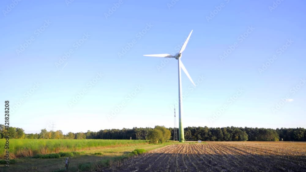 wind energy plant with powerline and green landscape wind energy plant with powerline and green landscape