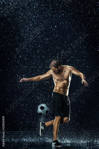 Water drops around football player under water