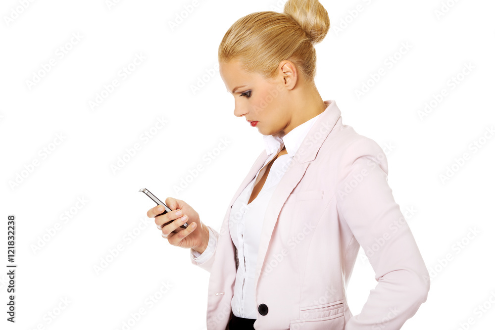Young business woman using a mobile phone Young business woman using a mobile phone