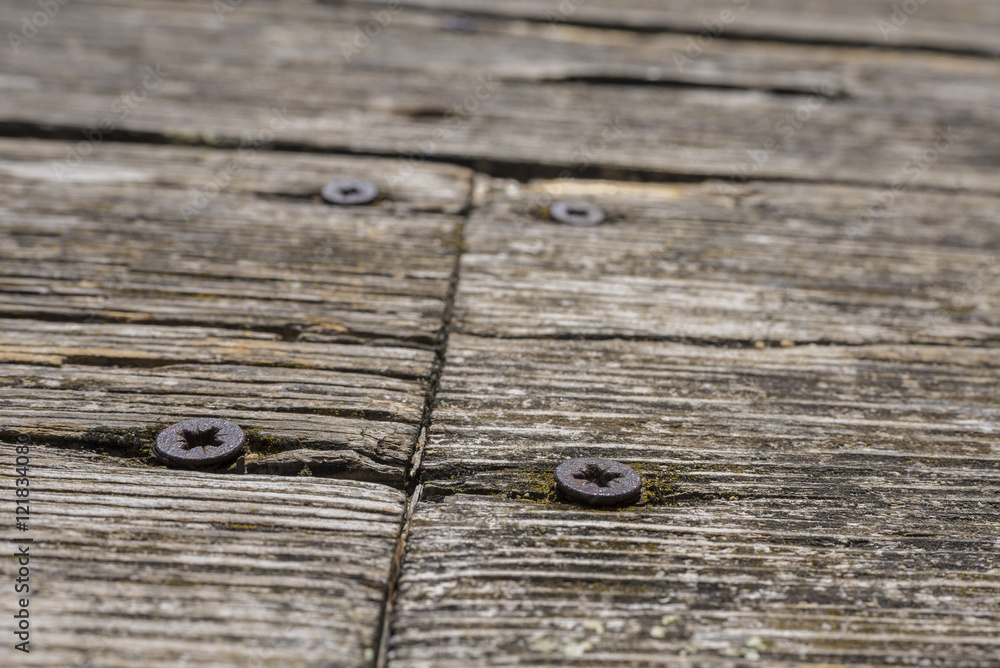Wooden board and screws. Wooden board and screws.