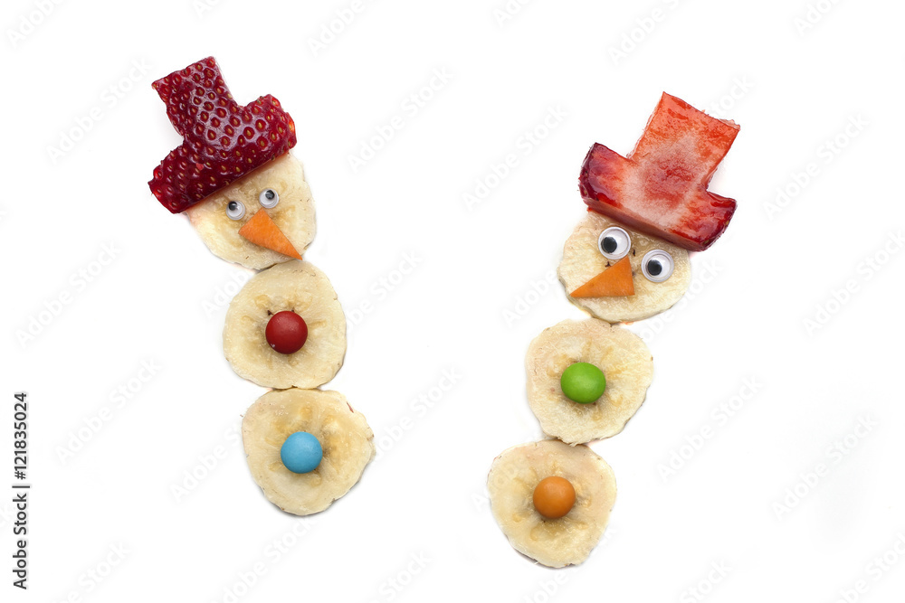 Food art creative concepts. Cute Christmas decoration made of fruits and vegetables over a white background. Food art creative concepts. Cute Christmas decoration made of fruits and vegetables over a white background.